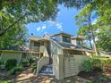 Townhome with exterior stairs and lush green landscaping at 226 Westleton Dr. # 19-D, Myrtle Beach, SC 29572