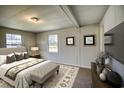 Cozy bedroom with a queen bed, bench, and neutral decor at 1119 Blue Ridge Trail, North Myrtle Beach, SC 29582