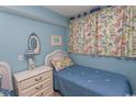 Bedroom with twin beds and beach decor at 523 S Ocean Blvd. S, North Myrtle Beach, SC 29582