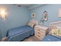 Two twin beds, white dresser, and coastal decor at 523 S Ocean Blvd. S, North Myrtle Beach, SC 29582