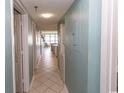 Clean hallway with tile flooring and laundry area at 523 S Ocean Blvd. S, North Myrtle Beach, SC 29582