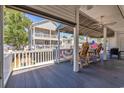 Relaxing deck with outdoor seating, overlooking backyard at 6001 S Kings Hwy., Myrtle Beach, SC 29575