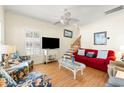 Comfortable living room with stylish furniture and hardwood floors at 6001 S Kings Hwy., Myrtle Beach, SC 29575