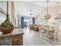 Bright living room with dining area and access to balcony at 5801 Oyster Catcher Dr. # 432, North Myrtle Beach, SC 29582