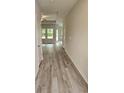 Bright entryway with luxury vinyl plank flooring and access to other rooms at 328 Palmetto Sand Loop, Conway, SC 29527