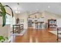 Open concept kitchen and dining area with hardwood floors at 1459 Tiger Grand Dr., Conway, SC 29526