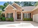 Brick front of house with a double door entry and landscaping at 6225 Longwood Dr., Murrells Inlet, SC 29576