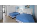 Bright bedroom with two double beds, and ocean-themed decor at 201 74Th Ave. N # 2829, Myrtle Beach, SC 29572