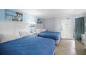 Bedroom with two double beds and direct access to balcony at 201 74Th Ave. N # 2829, Myrtle Beach, SC 29572