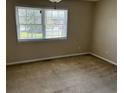 Bright bedroom with neutral walls, carpeting, and a large window at 1025 Carolina Rd. # G-3, Conway, SC 29526