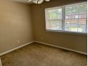 Spacious bedroom with neutral walls, carpeting, and a window with blinds at 1025 Carolina Rd. # G-3, Conway, SC 29526