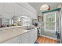 Kitchen with white cabinets, stainless steel appliances, and a breakfast bar at 631 Woodmoor Dr. # 303, Murrells Inlet, SC 29576