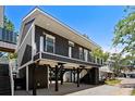 Modern two-story home on stilts with balcony at 6001-N37 S Kings Hwy., Myrtle Beach, SC 29575