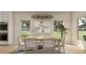 Bright dining room with large windows and wooden table at 590 Beckham Ct., Murrells Inlet, SC 29576