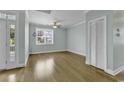 Bright and airy living room with hardwood floors and large window at 6 Cottage Dr., Murrells Inlet, SC 29576