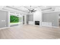 Spacious living room with fireplace and sliding glass doors leading to backyard at 1012 Maccoa Dr., Conway, SC 29526