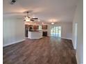Open living room and kitchen with hardwood floors and stainless steel appliances at Tbd 4 Casey Dr., Nichols, SC 29581