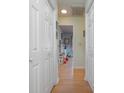 Hallway with wood floors and access to bedrooms at 6458 Sweet Gum Trail, Myrtle Beach, SC 29588