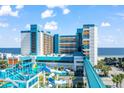 Oceanfront hotel with waterpark and walkway, offering stunning ocean views at 1501 S Ocean Blvd. # 1235, Myrtle Beach, SC 29577