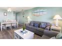 Beach-themed living room with dining area and comfortable seating at 202 75Th Ave N # 5706/5707, Myrtle Beach, SC 29572