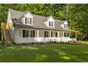 Two story home with wrap around porch and detached garage at 3758 Loblolly Ave., Little River, SC 29566
