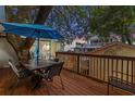 Relaxing deck with table, chairs, and umbrella, perfect for outdoor dining at 6001 - 1864A S Kings Hwy., Myrtle Beach, SC 29575