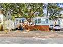 Quaint cottage with deck and golf cart. Landscaped yard and spacious driveway at 6001 - 1864A S Kings Hwy., Myrtle Beach, SC 29575