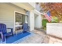 Cozy patio with blue chairs and a small table at 100 Shadow Moss Pl. # 57, North Myrtle Beach, SC 29582