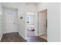 Bright entryway with hardwood floors and access to bedroom and bath at 537 Duvall St., Longs, SC 29568