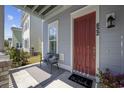 Inviting front porch with a bench and potted plants at 822 Farrow Pkwy., Myrtle Beach, SC 29577