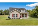 Newly built house with red shutters and a covered porch at 1168 St. John Rd., Galivants Ferry, SC 29544
