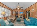 Cozy living room with comfy sofas, a fireplace, and a large TV at 6001- L40 S Kings Hwy., Myrtle Beach, SC 29575