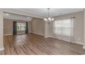 Bright dining room with hardwood floors and a chandelier at 238 Sea Turtle Dr., Myrtle Beach, SC 29588