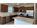 Modern kitchen with stainless steel appliances and granite countertops at 1336 Winding Creek Way, Myrtle Beach, SC 29588