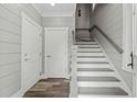 Modern staircase with gray risers and white railing at 1612 16Th Ave., Conway, SC 29526