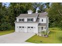 Two-story white barn-style house with double garage at 1612 16Th Ave., Conway, SC 29526