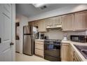 Kitchen with stainless steel appliances and light wood cabinets at 4103 Pinehurst Circle # Bb-11, Little River, SC 29566