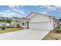 Spacious two-car garage and beautifully landscaped front yard at 8811 Smithfield Dr. Nw, Calabash, NC 28467