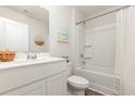 Small bathroom with white vanity, tub, and shower at 827 Buttonwood Dr., Conway, SC 29527