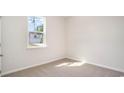 Simple bedroom with carpeted floor and a window at 580 Duvall St., Longs, SC 29568