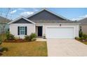 Single-story house with a white garage door at 805 Woodland Farms Circle, Aynor, SC 29511