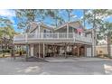 Two-story home with a large deck and covered parking at 6001 - 7026 S Kings Hwy., Myrtle Beach, SC 29575