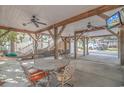Relaxing covered patio with seating area, hammock, and ceiling fans at 6001 - 7026 S Kings Hwy., Myrtle Beach, SC 29575