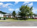 Two-story brick building with walkway and landscaping at 5056 Glenbrook Dr. # 202, Myrtle Beach, SC 29579