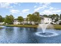 Building exterior with a scenic water view and fountain at 5056 Glenbrook Dr. # 202, Myrtle Beach, SC 29579
