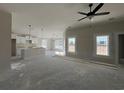 Open living space with kitchen island and neutral colors at 8193 Kerl Rd., Conway, SC 29526