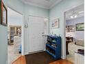 Bright entryway with shoe storage and views to other rooms at 5882 Longwood Dr. # 204, Murrells Inlet, SC 29576