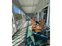 Relaxing screened porch with rocking chairs at 334 Norris Dr., Pawleys Island, SC 29585