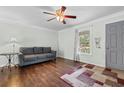 Living room with hardwood floors, sofa, and ceiling fan at 606 Burcale Road Circle, Myrtle Beach, SC 29588