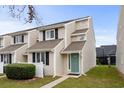 Two-story townhouse with teal door and landscaping at 500 Deer Creek Rd. # D, Surfside Beach, SC 29575